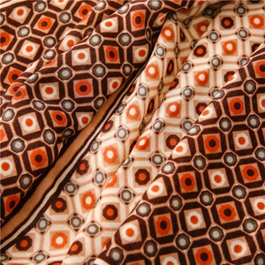 Close-up of geometric diamond print scarf with soft cotton-linen feel and smooth texture