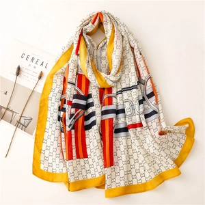 Lightweight cotton linen shawl with yellow equestrian horsebit and letter chain patterns