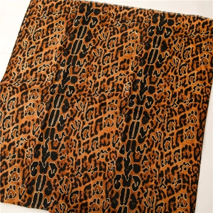 Linen feel leopard print scarf with gold foil accents and fringe edges for women