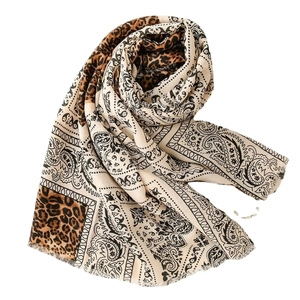 Linen feel scarf for women with leopard and paisley print featuring frayed edges on white background