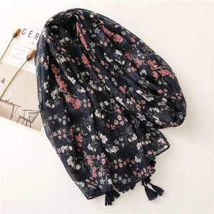 Navy floral scarf with tassels and red cherry blossom print on a light fabric