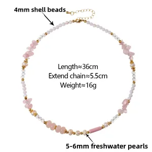 Detail of beaded necklace featuring pink stones, freshwater pearls and shell beads