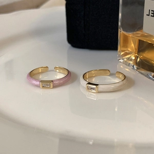 Enamel rings with rectangular zircon inlay in cream and pastel pink colors