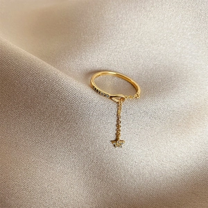 Minimalist gold star charm ring with zircon pavé and dainty adjustable chain design