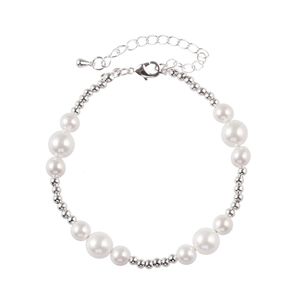 Detail of elegant pearl bracelet with varied bead sizes and adjustable lobster clasp