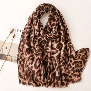 Brown leopard print scarf with fringe edges and lightweight linen texture