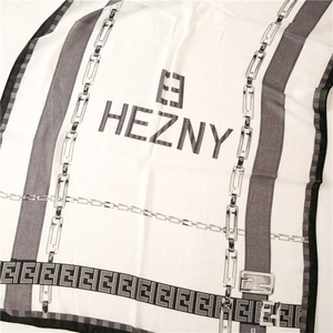 Detail of the chain pattern and HEZNY letter logo on this cotton linen scarf