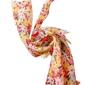 Soft floral print scarf for women with yellow and pink patterns and tassel fringe detail