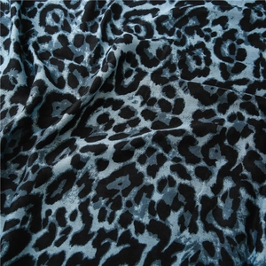 Detail view of cotton-linen feel scarf showing blue and black leopard print pattern