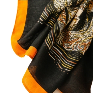 Long cotton linen scarf in black with orange borders and classic architecture pattern