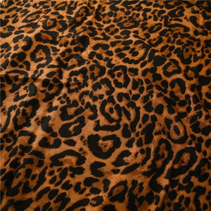 Macro detail of classic leopard print scarf in warm brown tones with soft texture