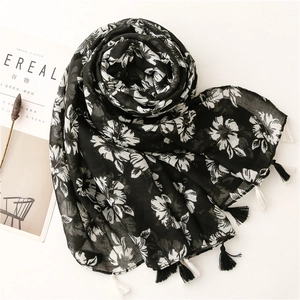 Soft black floral scarf with tassels and artistic flower print for autumn and winter