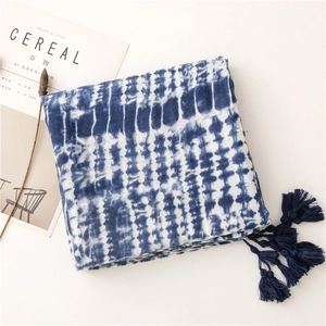 Detailed blue and white tie-dye cotton-linen scarf with dark blue fringe tassels