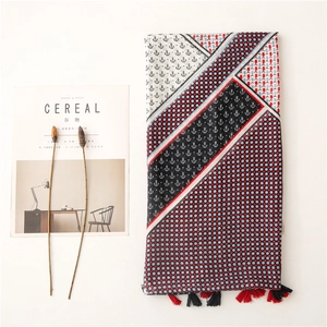 Vintage nautical scarf with anchor prints, polka dots and handmade tassels in a flat lay
