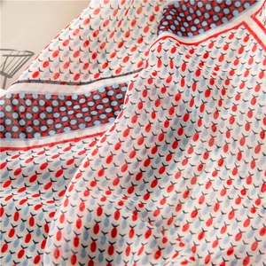 Vintage nautical scarf with red fish print and anchor patterns on navy blue fabric