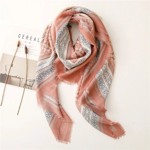 Coral pink and blue geometric pattern scarf with fringe edges in elegant linen style