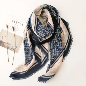 Ethnic geometric print scarf in navy blue with fringe details and soft linen texture