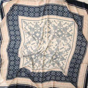 Detail of geometric ethnic pattern on soft cotton linen shawl with fringe edges