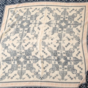 Close-up of geometric pattern on ethnic cotton linen scarf with frayed edges