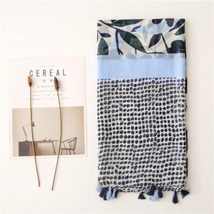 Blue linen-feel scarf with cherry leaf print, dotted texture and delicate blue tassels