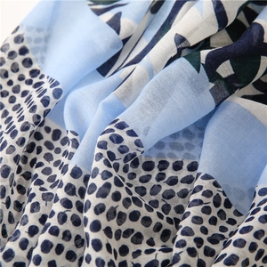 Elegant cotton linen scarf with blue cherry leaf print and soft tassel details for women