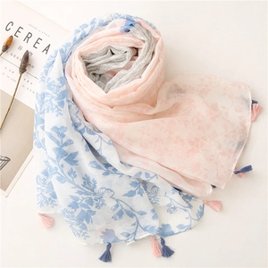 Detailed shot of leaf print cotton linen scarf with soft fringe tassels on the edges