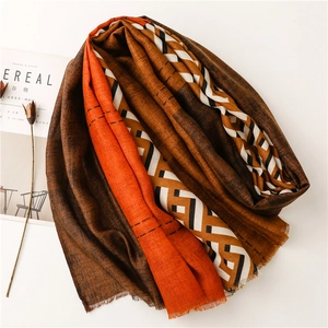 Close-up of color-block scarf with geometric patterns and natural frayed edges