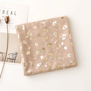 Detail of pink lightweight scarf with gold and silver metallic leopard print pattern