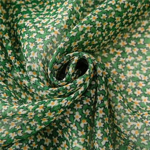 Green floral voile shawl with small daisy prints and tassel hem for sun protection