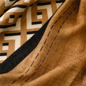 Detailed macro view of geometric pattern and fine stitching on the thick cotton scarf