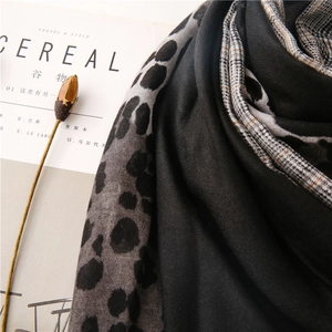 Close-up of leopard and houndstooth pattern mix scarf with a soft cotton-linen feel