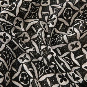 Macro detail of kaleidoscope geometric print on cotton-linen texture fabric scarf