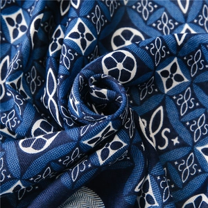 Macro view of blue kaleidoscope pattern cotton linen scarf with detailed fabric texture