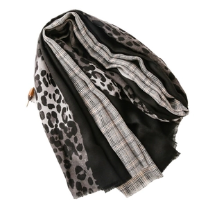 Leopard and plaid patterned long scarf with fringe edges in grey and black tones
