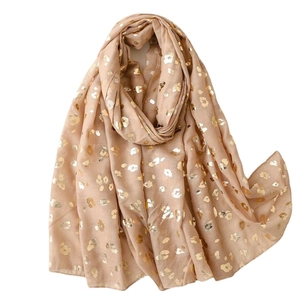 Beige cotton scarf for women with shimmering gold leopard pattern and soft fringe edges