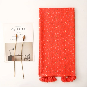 Red cotton linen scarf with gold foil dots, white paw prints and fringe tassel edges