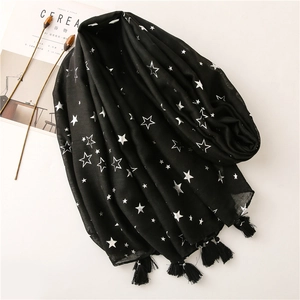 Black cotton linen scarf with silver star print and tassels on white background