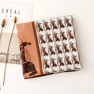 Detailed close-up of retro carriage print scarf on stylish lifestyle background