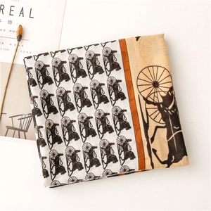 Detailed pattern of vintage carriage print on lightweight white cotton linen scarf
