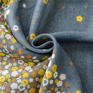 Floral print cotton linen scarf in hazy blue with yellow floral pattern for sun protection