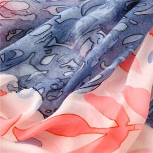 Close-up of abstract blue and pink printed lightweight breathable scarf fabric texture
