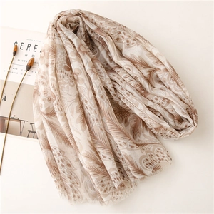 Soft voile scarf with khaki floral print and fringe edges for sun protection