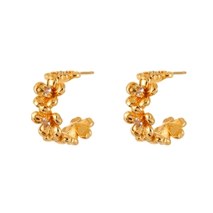 Elegant gold flower hoop earrings with sparkling zircon crystals on white background