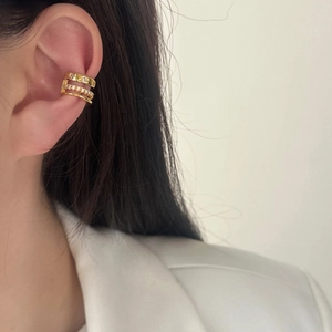 Chic triple-layer gold ear cuff with zircon inlay and dot texture on ear cartilage