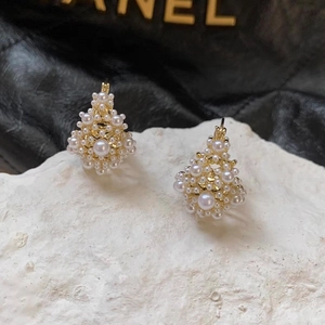 Elegant French-style gold hollow diamond earrings with lustrous pearls on stone