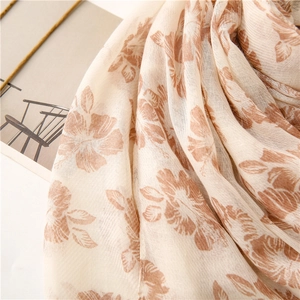Close-up of floral print on cotton linen scarf showing breathable fabric texture