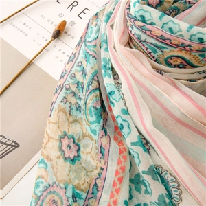 Close-up of soft paisley floral pattern on breathable lightweight voile cotton scarf