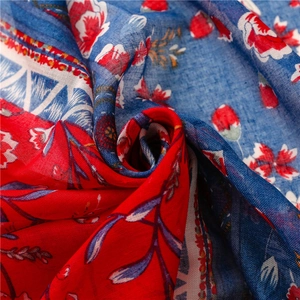 Ethnic style floral print shawl in red and blue featuring soft fabric texture and drape