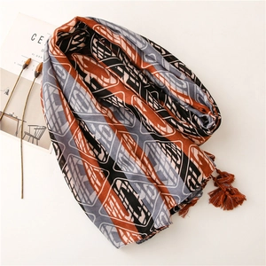 Blue graffiti cotton linen shawl with geometric diamond patterns and orange fringe