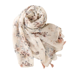 Soft voile scarf with vintage floral patterns and tassel edges on white background